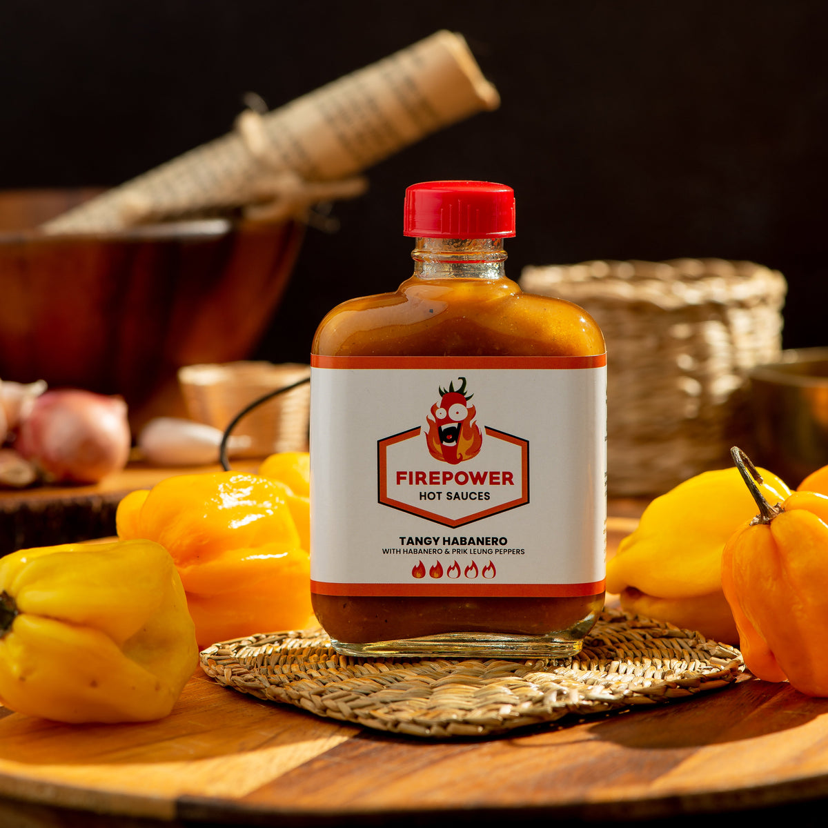 An 85ml bottle of Firepower Tangy Habanero hot sauce — a tangy, roasted habanero sauce made in Bangkok.