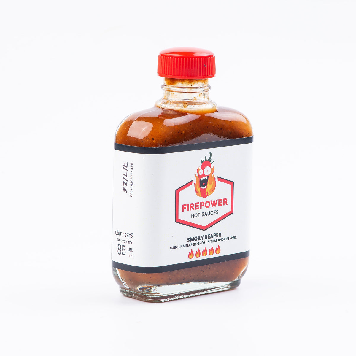 Left angled 85ml bottle of Firepower Smoky Reaper hot sauce — a limited-batch Carolina Reaper sauce made in Bangkok.