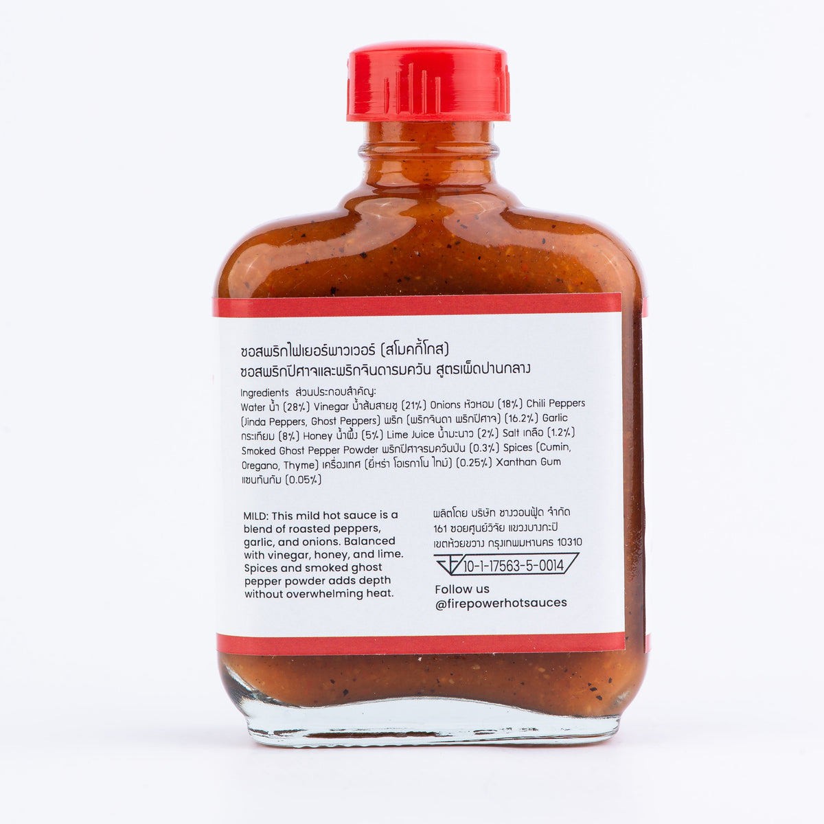 The back of an 85ml bottle of Firepower Smoky Ghost Level 1 hot sauce with white background — a mild, smoky ghost pepper sauce made in Bangkok