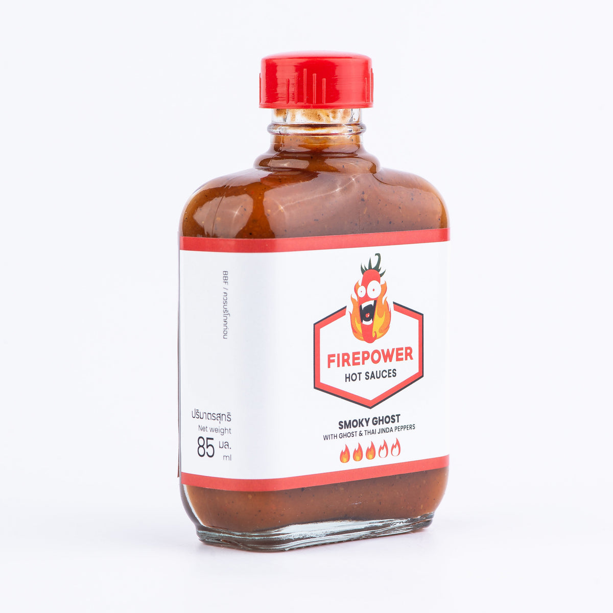 Left angled 85ml bottle of Firepower Smoky Ghost Level 3 hot sauce — our best-selling smoky ghost pepper sauce for BBQ and more, made in Bangkok.