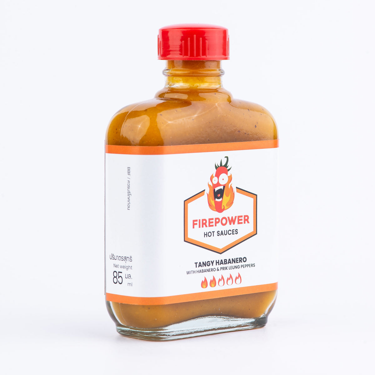 Left angled 85ml bottle of Firepower Tangy Habanero hot sauce — a tangy, roasted habanero sauce made in Bangkok.