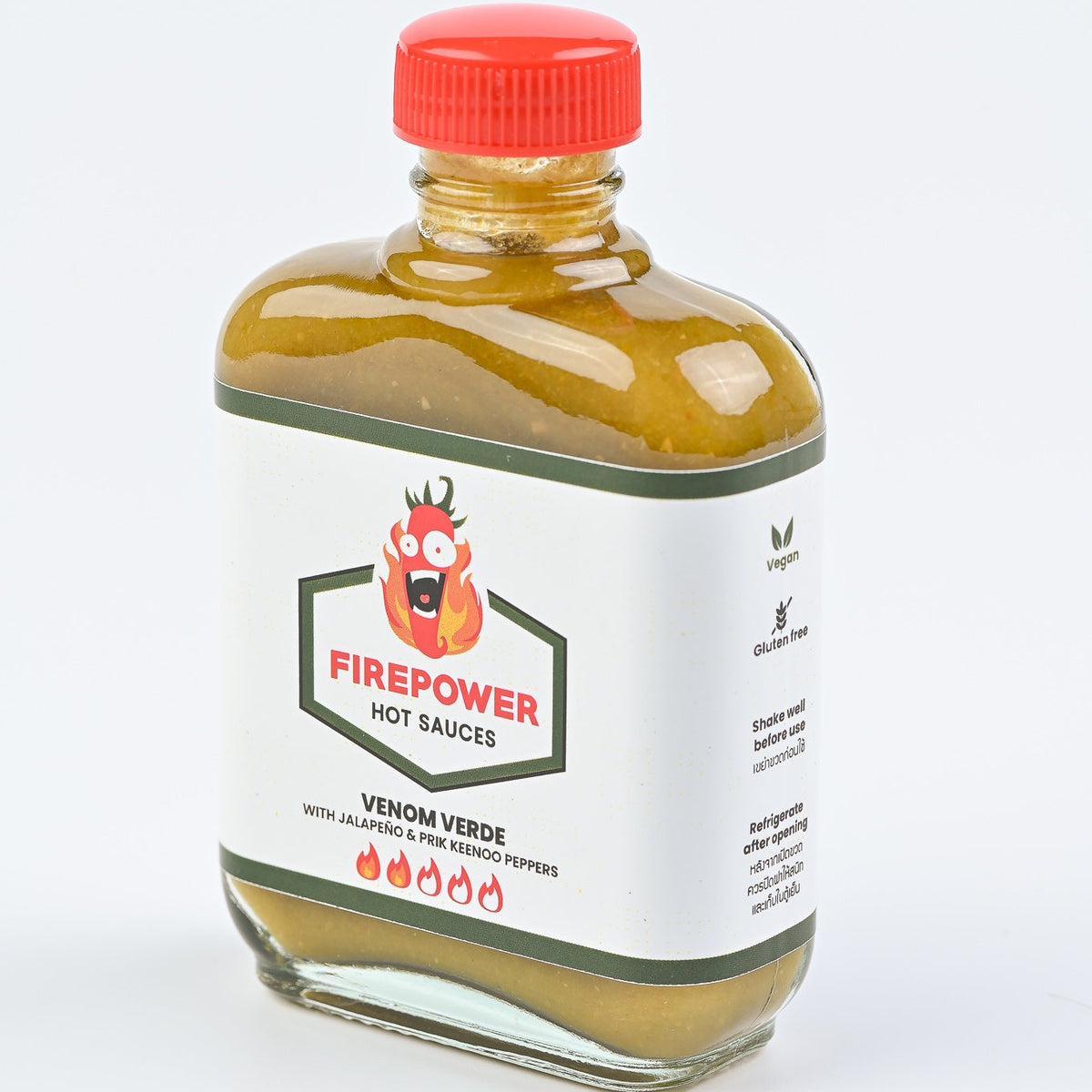 Right angled 85ml bottle of Firepower Venom Verde hot sauce — a green salsa-verde-style jalapeño sauce made in Bangkok.